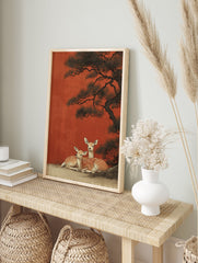 Japanese wall art print featuring two spotted deer resting under a dark pine tree against a vibrant red-orange background. - Image 3