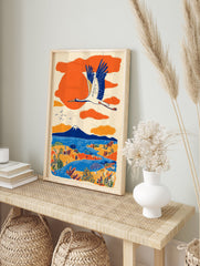 Japanese wall art print of a white crane flying over an orange and blue landscape with Mount Fuji, lake, and trees. - Image 3