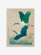 Japanese Ukiyo-e wall art print showing two teal and white flying cranes over vibrant blue-green ocean waves and script.