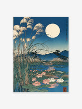 Japanese Wall Art print of a full moon over a pond with water lilies, tall reeds, and mountains in blue night tones.