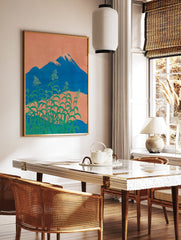 Japanese wall art depicting Mount Fuji, an orange sky, and lush green botanical plants with small white flowers in the foreground. - Image 2