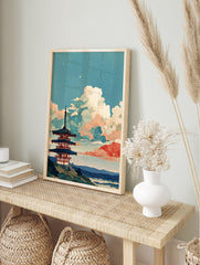 Japanese wall art print of a multi-tiered pagoda against a blue sky with stylized white and red clouds, stars, and a landscape. - Image 3