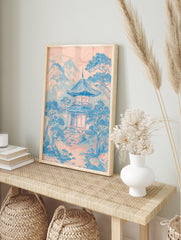 Japanese Wall Art print of a pink and blue pagoda temple in a serene mountain landscape with pine trees. - Image 3
