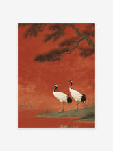 Japanese wall art print featuring two red-crowned cranes on a bank with a pine tree against a rich red background.