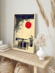 Japanese wall art print of an outdoor dining patio with a red sun, dark pergola, green vines, and ocean view. - Image 3