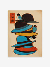 Japanese style wall art illustration of stacked colorful hats with three blue and black birds perched on them.