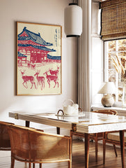 Japanese Wall Art print of Todai-ji Temple in red and blue, with several deer in the foreground on a cream background. - Image 2