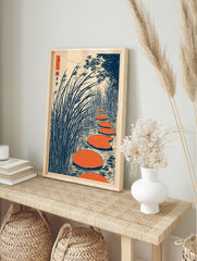 Japanese Ukiyo-e style wall art print showing orange stepping stones in water surrounded by tall blue reeds and trees. - Image 3