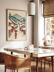 Japanese Wall Art print of a person in a red kimono with an umbrella walking down a snowy street with traditional houses and mountains. - Image 2