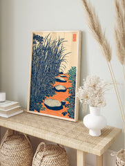 Japanese wall art print of a zen garden with stepping stones, tall blue-green grass, and orange water. - Image 3
