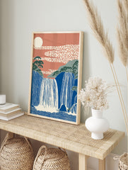 Japanese Waterfall Wall Art featuring blue cascading falls, green mountains, terracotta sky with patterned clouds and a cream sun. - Image 3