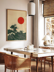 Japanese Ukiyo-e style art print of dark green ocean waves with white foam and a red sun, in a styled room mockup