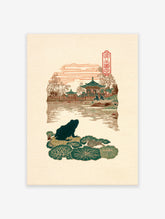 Dark green frog on lily pads in a Japanese woodblock print, with pagodas and mountains in a traditional Asian landscape.