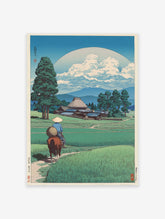 Traditional Japanese woodblock print of a horse rider in rice paddies with a village, mountains, and large moon/sun.