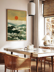 Japanese woodblock print of large ocean waves with white foam, distant mountains, and a red sun in, in a styled room mockup