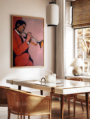 Abstract art print of a jazz musician playing a trumpet in red and brown tones against a light pink background. - Image 3
