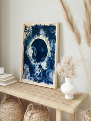 Cyanotype print of jellyfish and botanical silhouettes in deep blue and white, arranged in a, in an alternate framed mockup