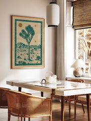 Illustrated Joshua Tree desert landscape poster with teal tree, mountains, and gold suns, framed by an ornate border. - Image 2