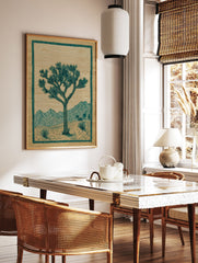 Joshua Tree poster depicting a desert landscape with mountains, two suns, and green botanical elements on brown paper. - Image 2