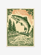 Vintage woodcut style illustration of a jumping fish in a river with pine trees and an orange sky.