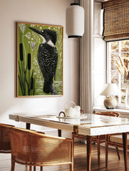 Illustrative linocut style print of a kingfisher bird among cattails and plants on a green, in a styled room mockup