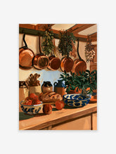 Rustic kitchen still life art print with copper pans, hanging herbs, apples, and a blue and white ceramic bowl