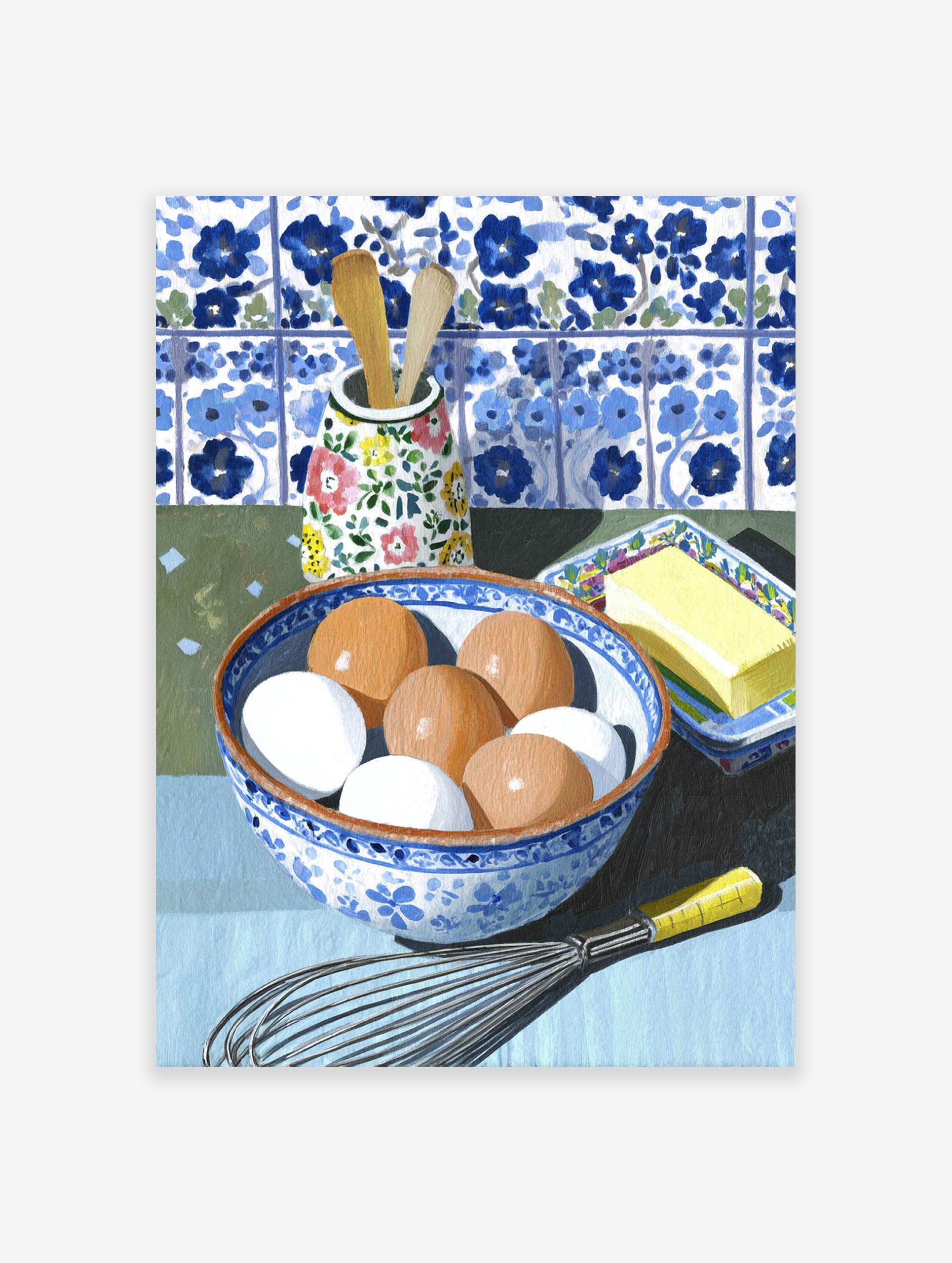 Kitchen Still Life Wall Art showing a bowl of eggs, butter, whisk, and wooden spoons against blue and white tiles.
