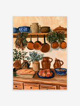 Rustic kitchen still life wall art with hanging copper pots, herbs, pottery, and bread in warm earth tones