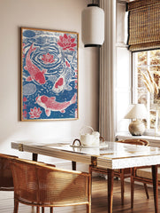 Japanese woodblock style print of three red and white koi fish swimming with red lotus flowers in a, in a styled room mockup