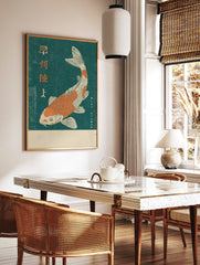 Orange and white koi fish woodblock print with Japanese Kanji text on a deep teal background, in a styled room mockup