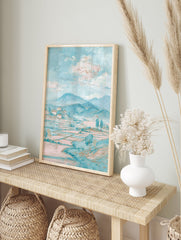Pastel blue and pink landscape painting of a serene village with houses, mountains, fields, and trees under a cloudy sky. - Image 3