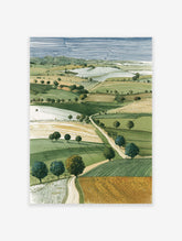 Illustrative landscape wall art print showing green and golden rolling fields, scattered trees, and a winding path under a striped blue sky.