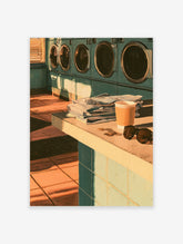 Laundromat poster with teal washing machines, folded laundry, coffee cup and sunglasses on a tiled counter
