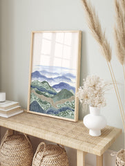 Illustrative layered landscape wall art print with blue and green mountains, textured hills, and a tranquil sky. - Image 3