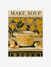 Cream pot with yellow lemon pattern and MAKE SOUP text on a kitchen stove with onions and garlic
