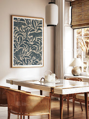 Stylised leopard pattern wall art featuring navy blue jungle foliage and big cats on a cream, in a styled room mockup