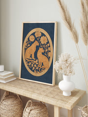 Two golden leopards with ornate floral designs in a circular border on a deep blue background, in an alternate framed mockup