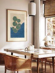 Modern botanical lily pad art print featuring green lily pads with orange outlines floating on a deep blue water background. - Image 3