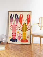 Colorful lobster wall art print featuring a pink and a yellow lobster with patterned claws and bodies, surrounded by coral. - Image 2