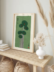 Japanese-inspired lotus leaf botanical print with dark green leaves, orange centres, white, in an alternate framed mockup