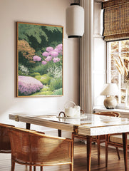 Lush garden scene botanical print with pink flowers, green foliage, and white blossoms in an, in a styled room mockup