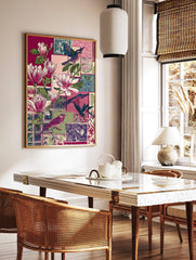 Illustrative collage print with pink magnolia flowers, various colourful birds, and patterned, in a styled room mockup