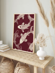 Several off-white Koi fish illustrations swimming on a deep maroon background, in a Japanese, in an alternate framed mockup