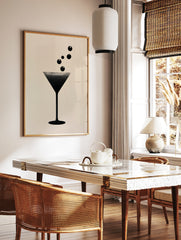 Minimalist martini glass graphic art print with halftone dot texture on a neutral background, in a styled room mockup