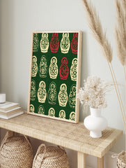 Repeating pattern of cream and red Russian Matryoshka nesting dolls with floral designs on a, in an alternate framed mockup
