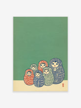 Matryoshka doll wall art print featuring six colorful Russian nesting dolls on a green and cream background.