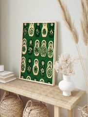 Repeating pattern of Matryoshka nesting dolls in dark green and cream, illustrative folk art, in an alternate framed mockup