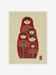 Red Matryoshka dolls wall art with green hair and floral designs on a textured cream background, folk art style.
