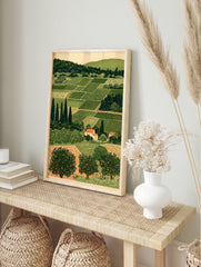 Illustrative rural landscape print with green agricultural fields, cypress trees, and orange, in an alternate framed mockup