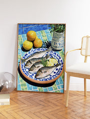Mediterranean still life painting with four fish, lemon slices, oranges, and rosemary on a blue and green tiled table with a plant. - Image 2